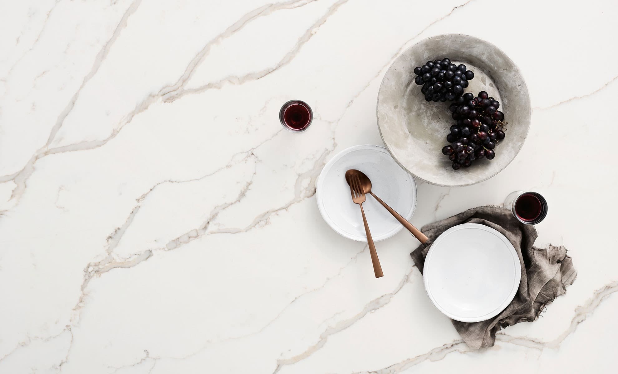 Quartz slab with a bowl of fruit on it