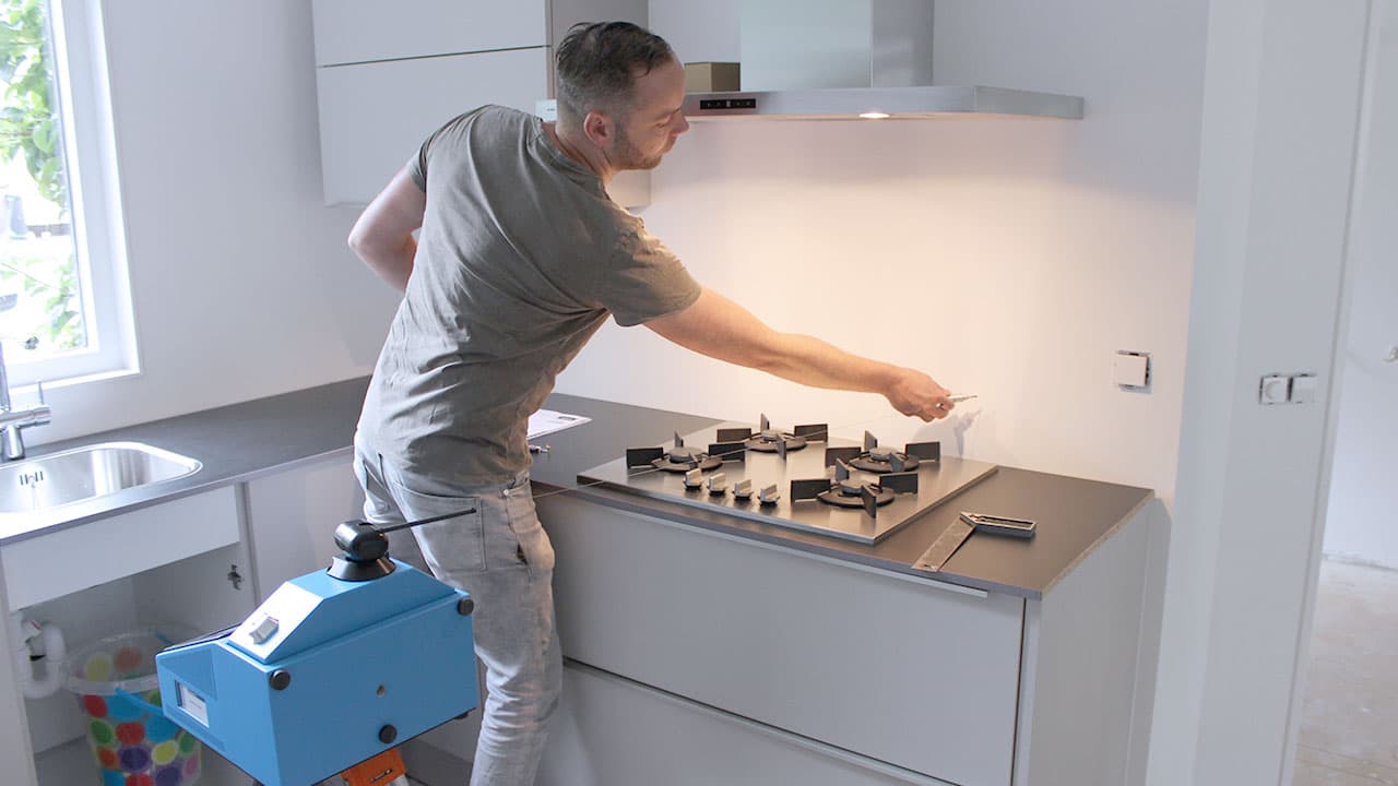 Stone professional using a digital templator to measure countertop